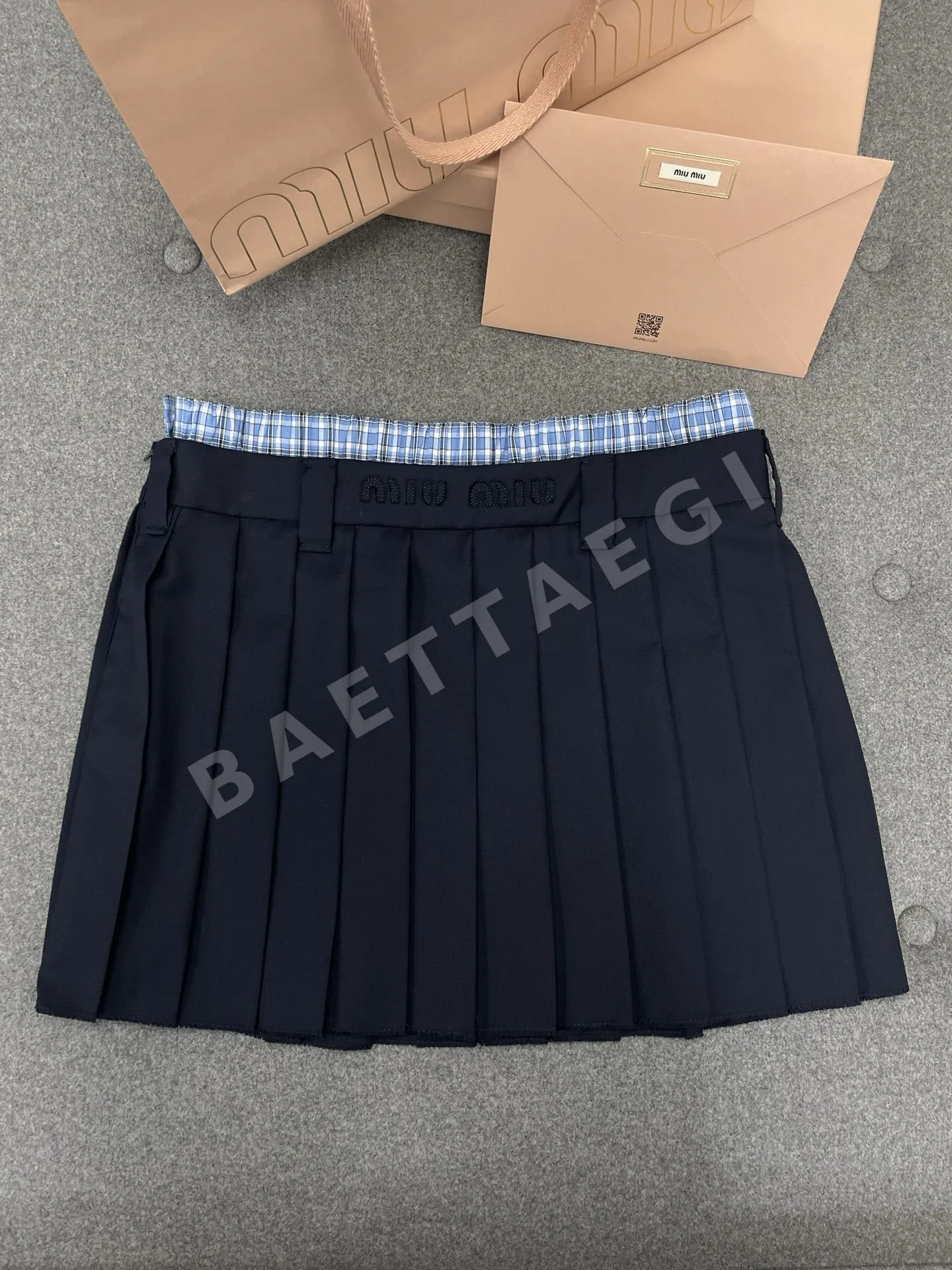 미우미우 체크 플리츠 스커트 129781