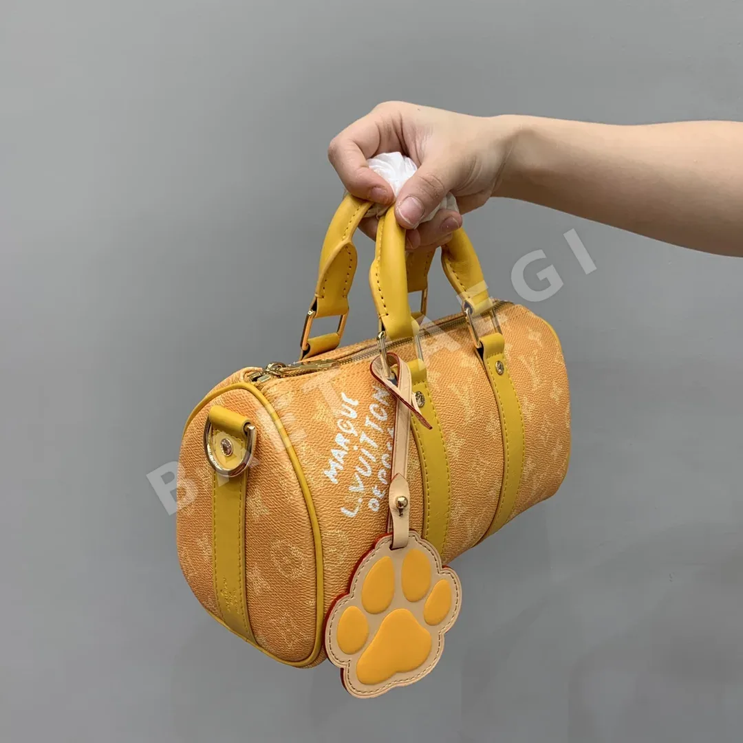 루이비통 옐로우 강아지 발자국 참 가방 M13166 상세 이미지 2